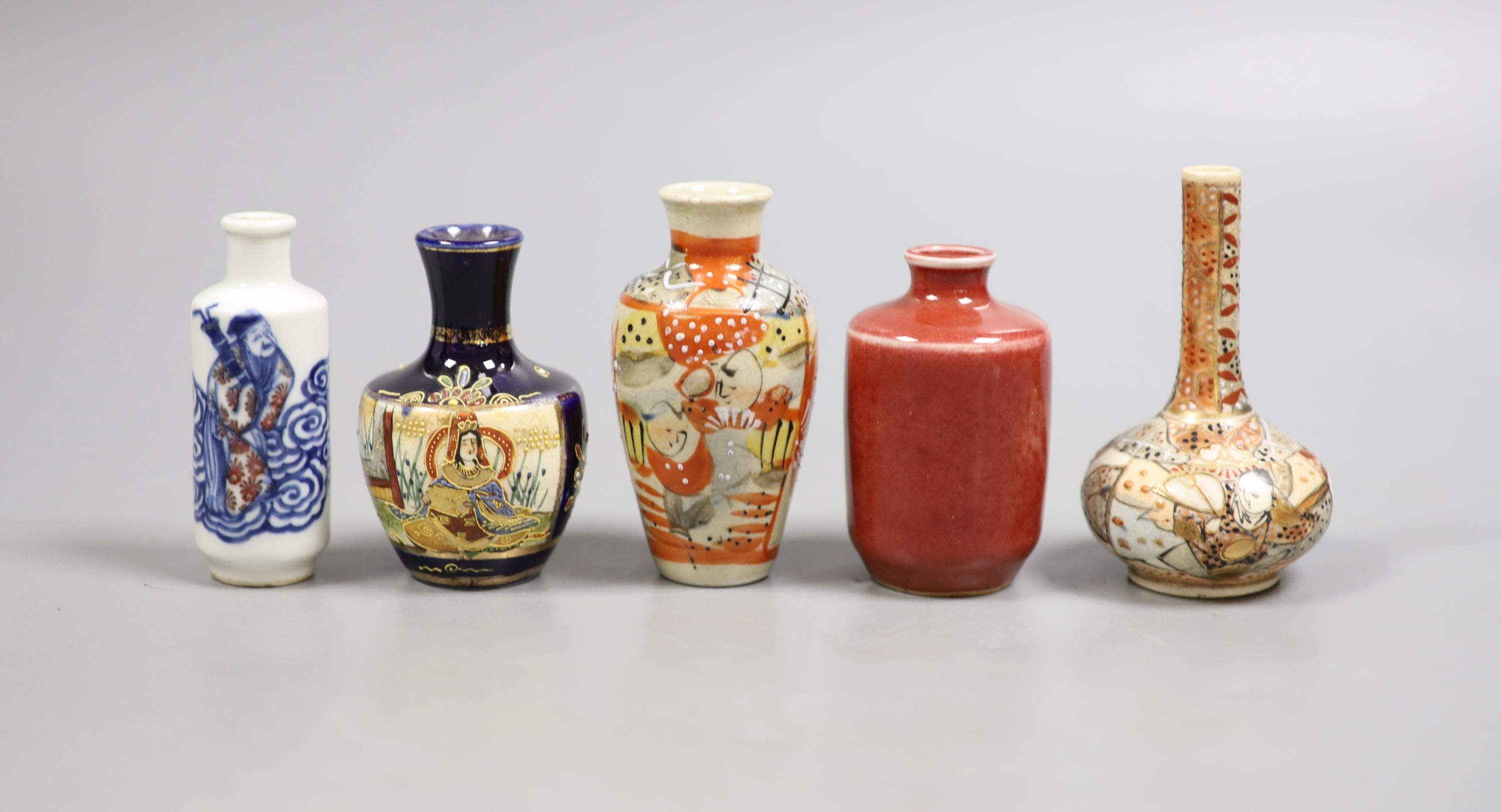 A group of five small Chinese porcelain and Japanese pottery vases, tallest 9.5 cm